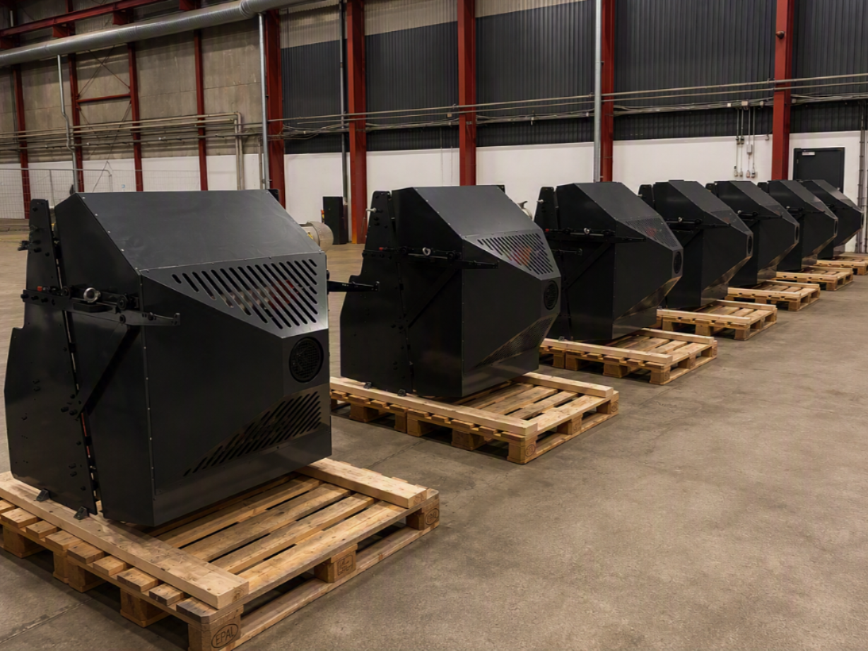 SustainaDryTech dryer units ready for delivery on wooden pallets in a warehouse