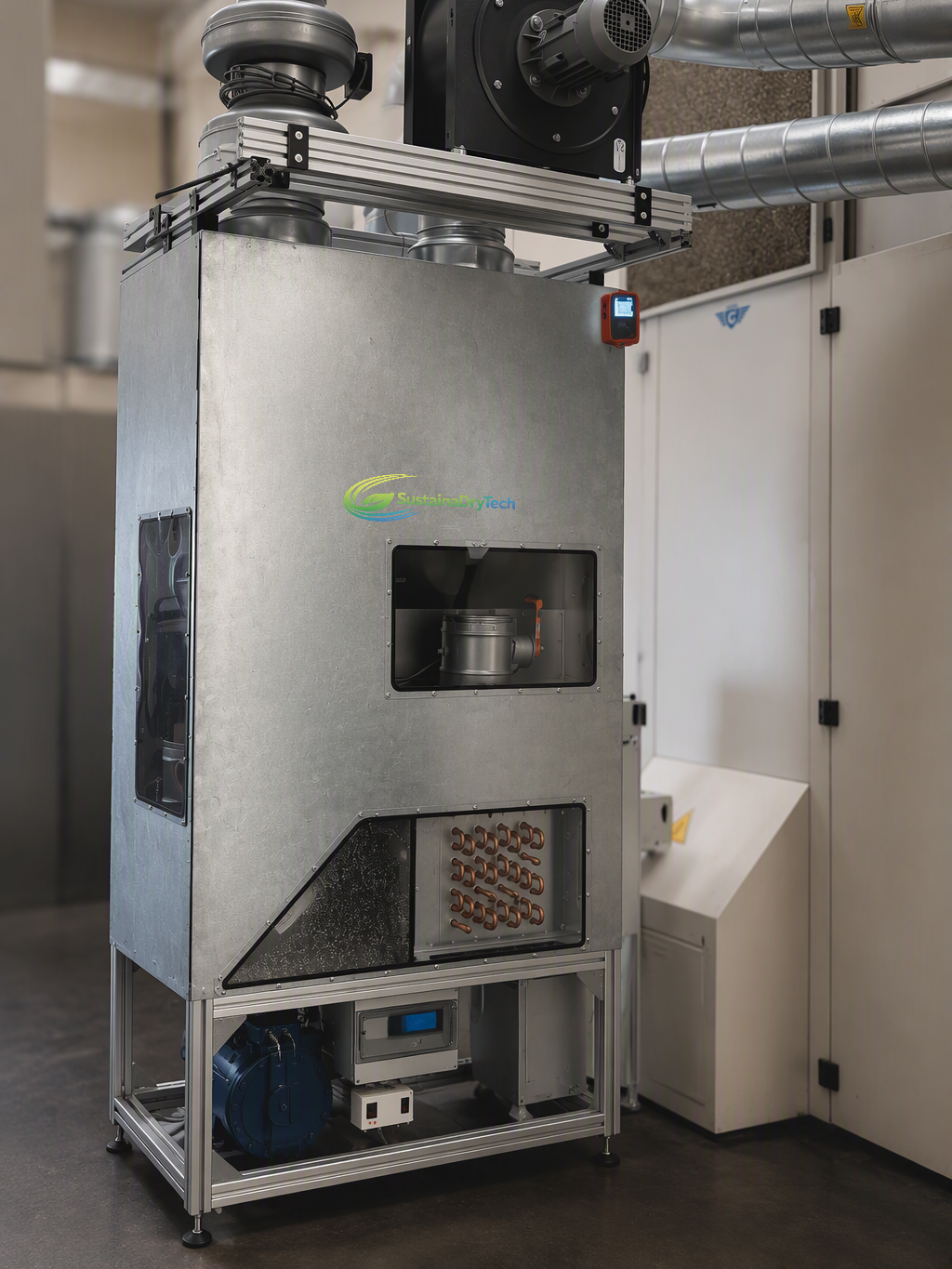 SustainaDryTech HPDU heat pump dryer unit installed in a production hall